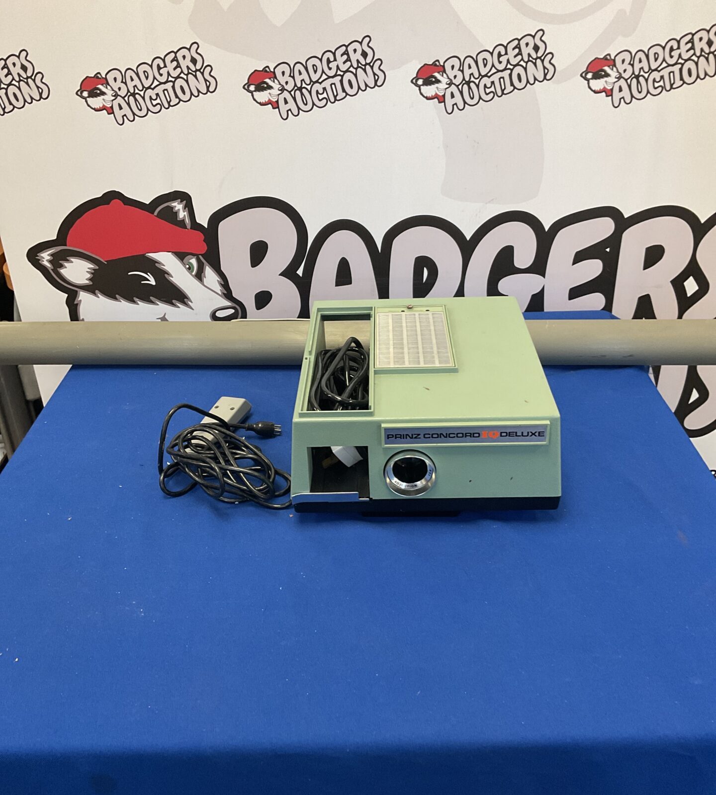 Vintage Prinz Concord IQ Deluxe projector with screen.