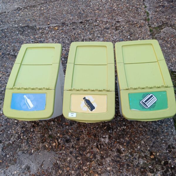Set of three green plastic recycling bins for waste sorting.