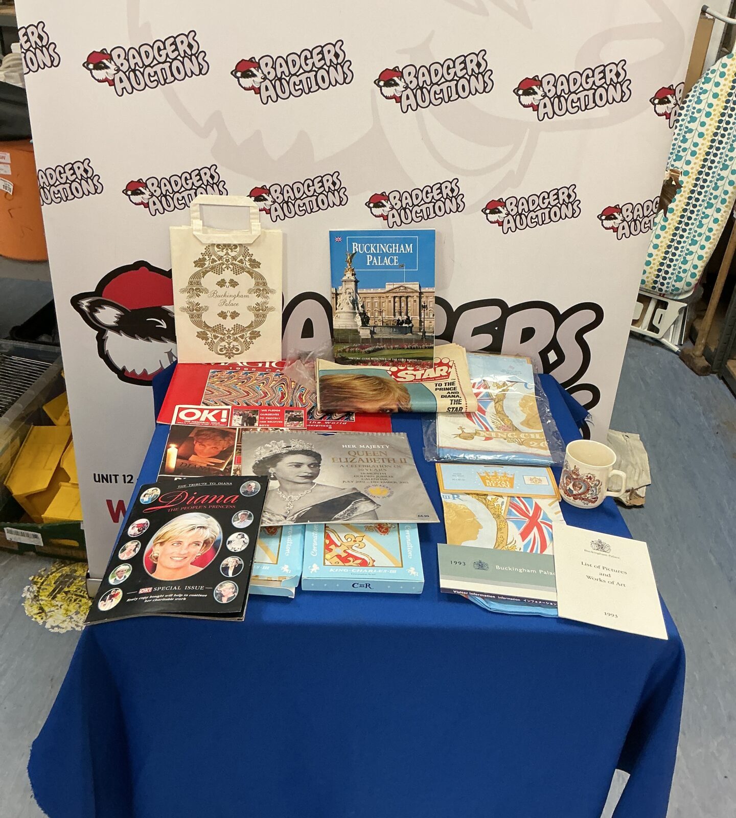 Royal Memorabilia collection featuring magazines and a tea towel.