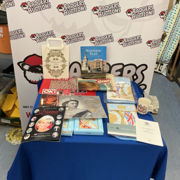 Royal Memorabilia collection featuring magazines and a tea towel.