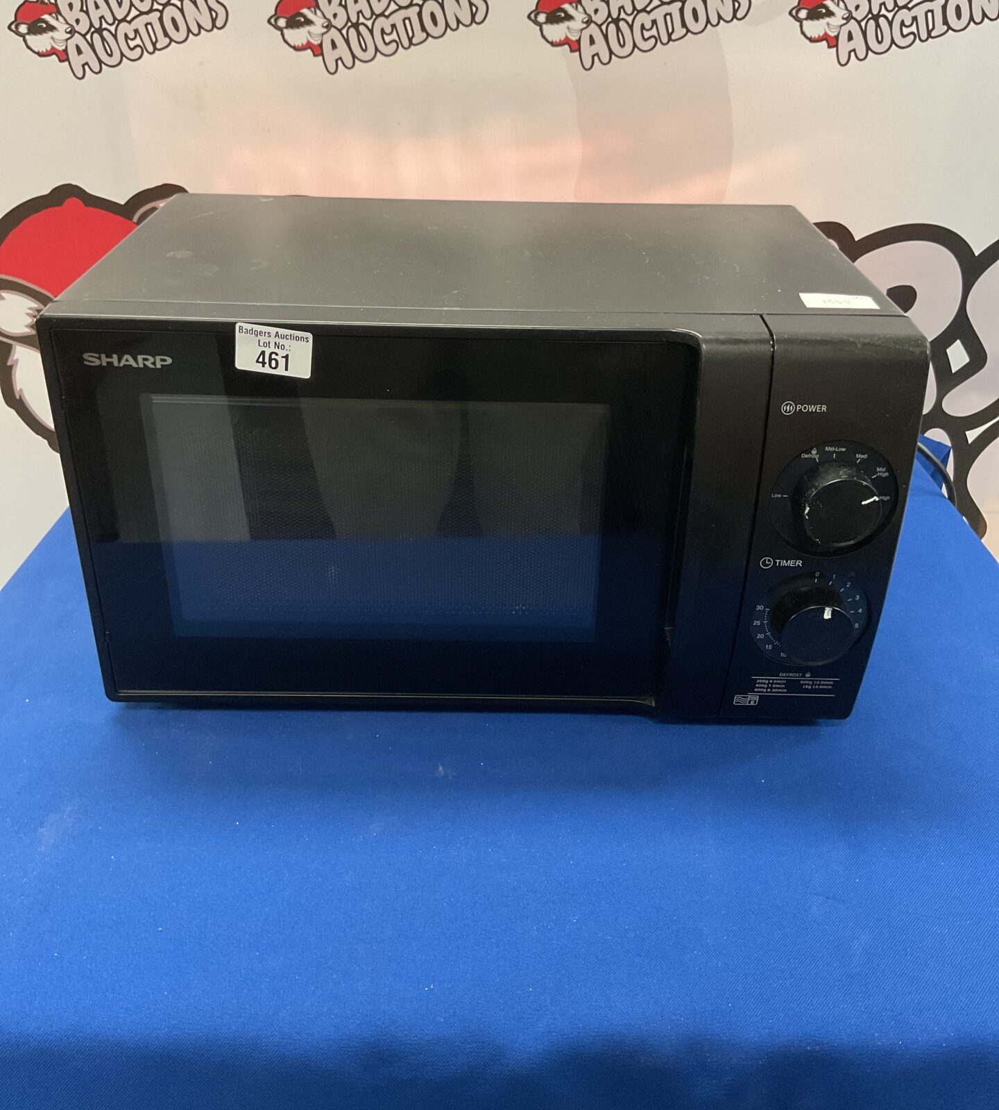 Vintage Sharp microwave appliance in good condition.