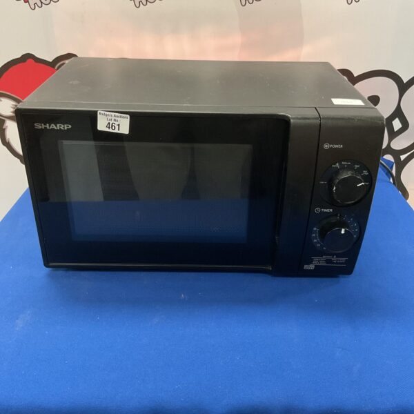 Vintage Sharp microwave appliance in good condition.