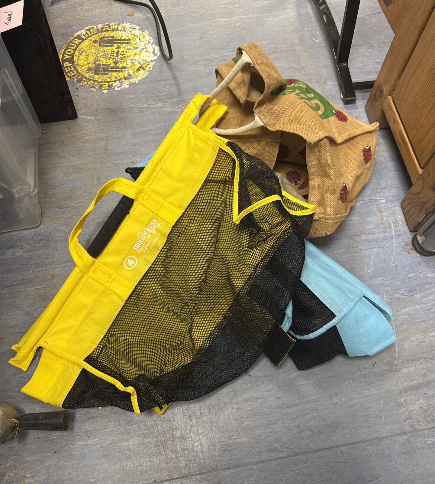 Bundle of reusable shopping trolley organisers and canvas bags.