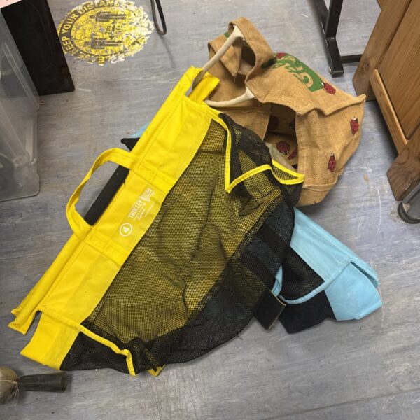 Bundle of reusable shopping trolley organisers and canvas bags.
