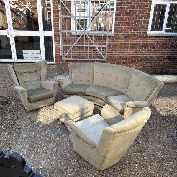 Yellow vintage banana sofa set with matching chairs and pouffe.
