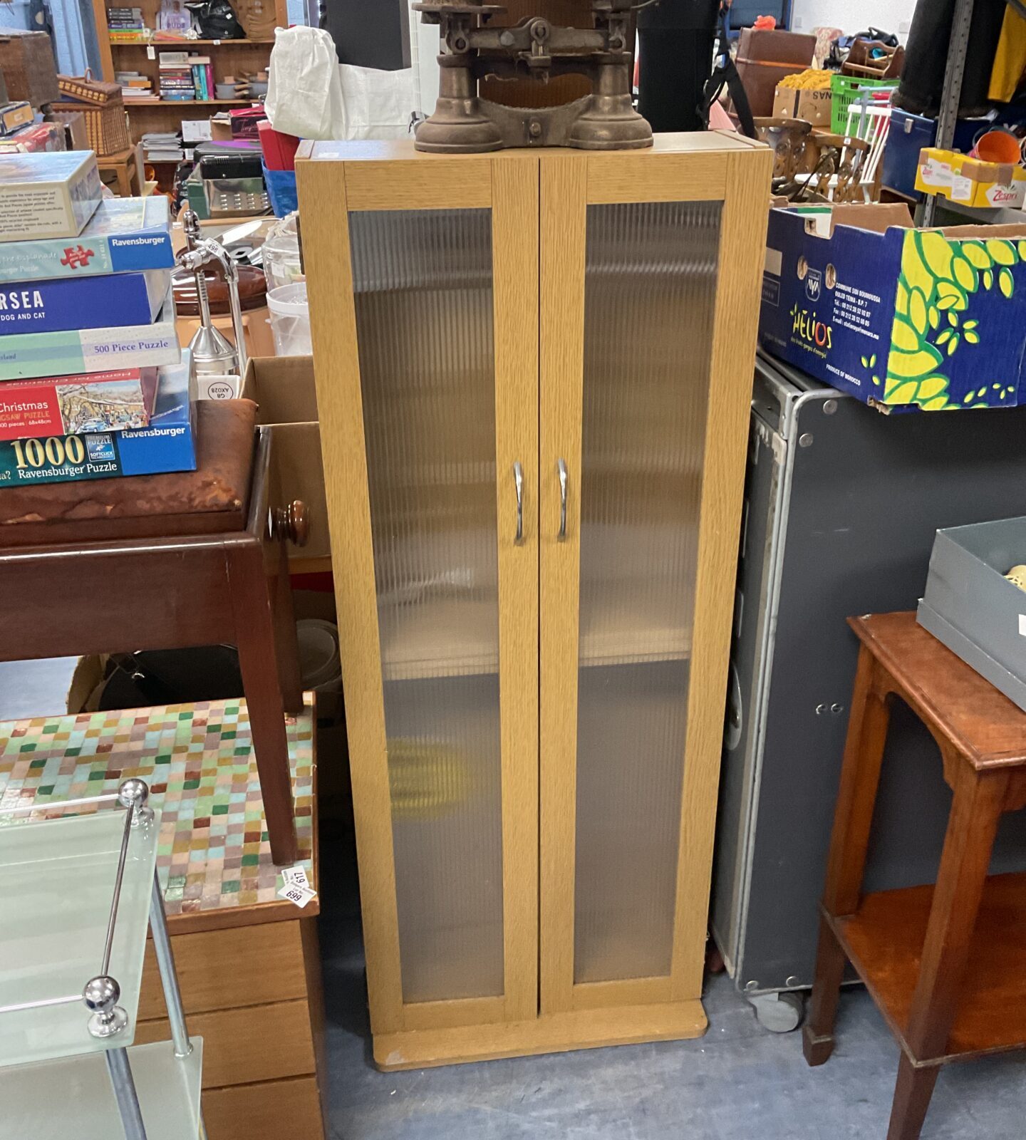 Vintage beech storage cabinet with a single door and shelving.
