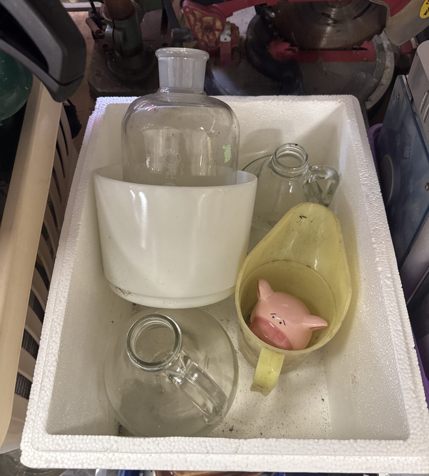 Vintage Pyrex jar with piggy bank and Duckhams oil jug.