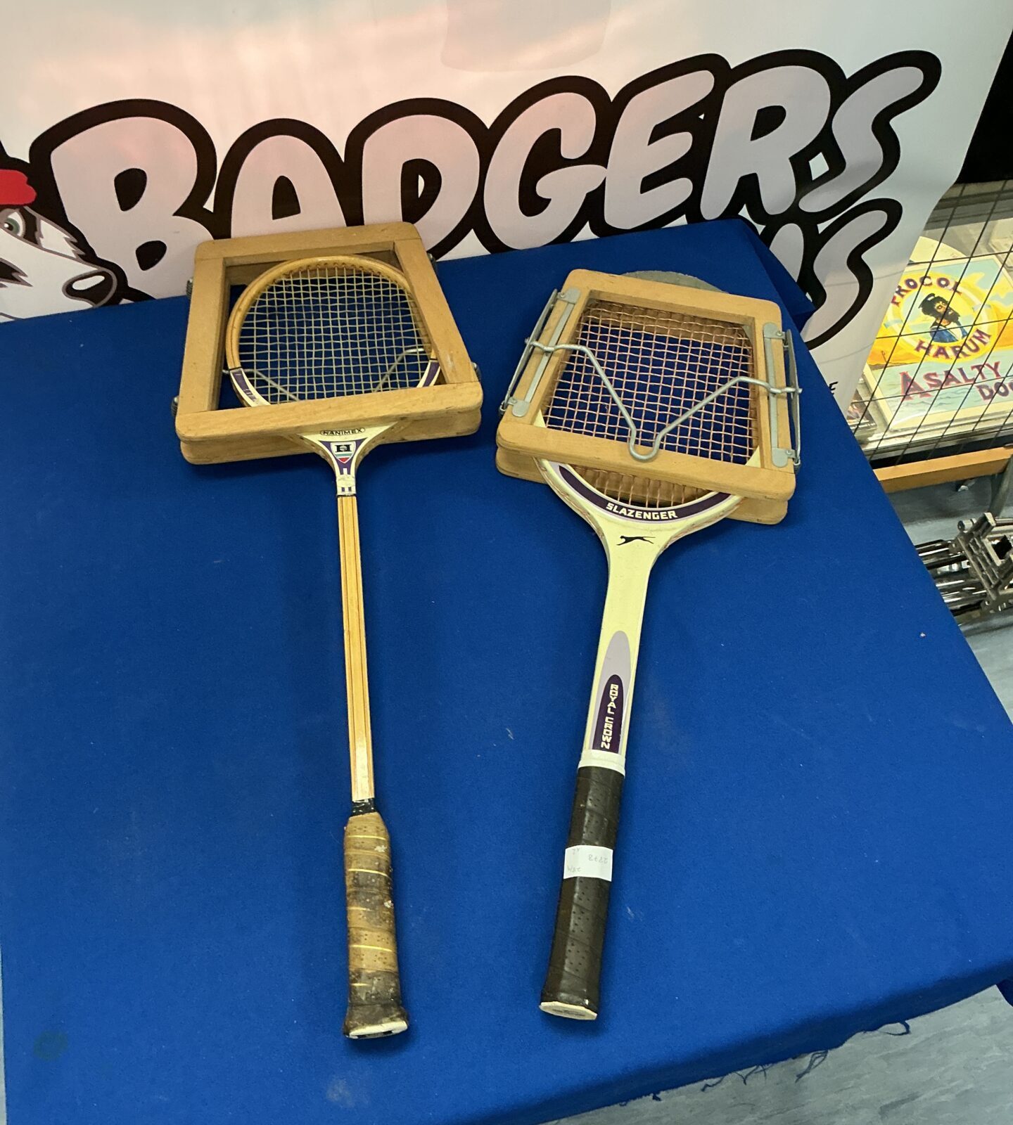 Pair of vintage wooden sports rackets for tennis or similar sports.