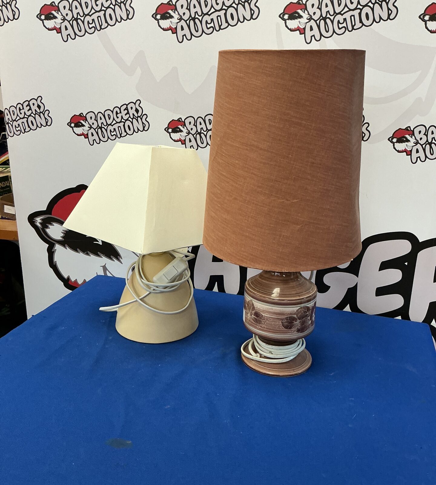 Vintage table lamps with cream shades and wooden bases.