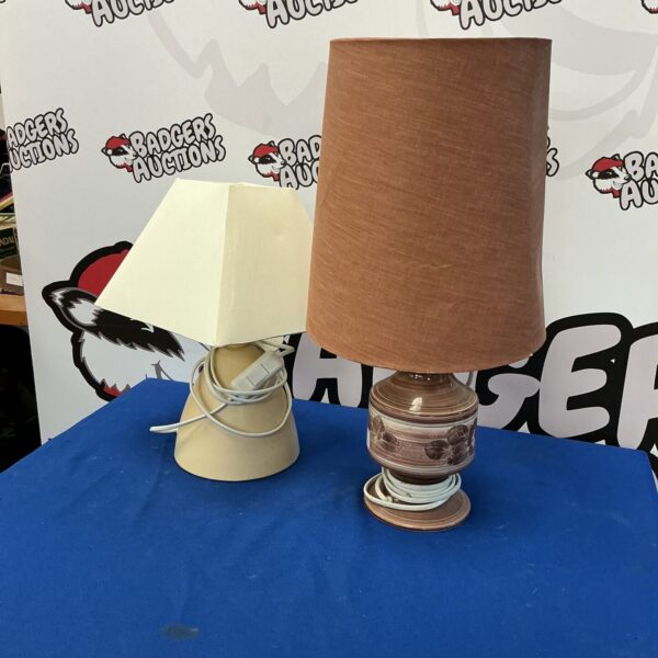 Vintage table lamps with cream shades and wooden bases.
