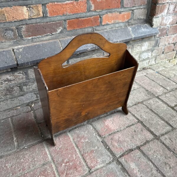 Vintage wooden magazine rack for books and periodicals.