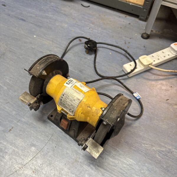 Close-up of a small 125mm bench grinder for spares or repairs.
