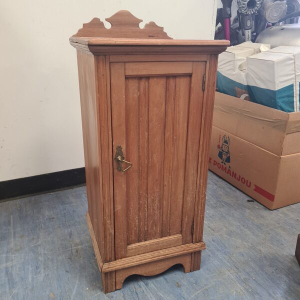 Antique Edwardian wooden cabinet with a single door.