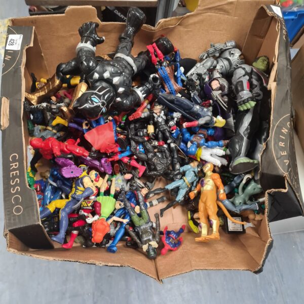 Mixed lot of vintage and retro action figures for collectors.