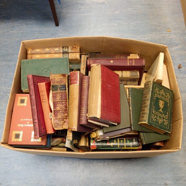 Overview of a large antique book lot with varied bindings.