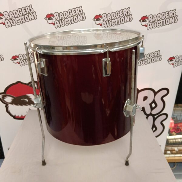 Red percussion drum for musical instrument collection.