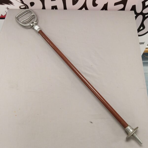 Vintage shooting stick with padded seat for hunting or observation.