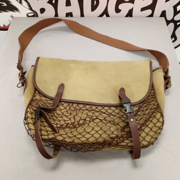 Vintage canvas shooting bag with netting front.