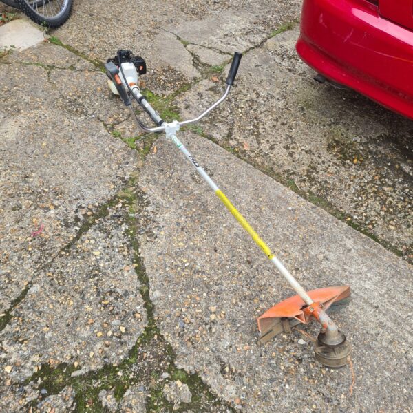 Used Stihl FS66 garden strimmer for sale, landscaping tool.