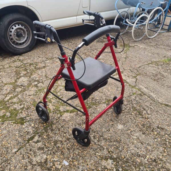 Red Drive mobility walking aid with wheels and adjustable handles.