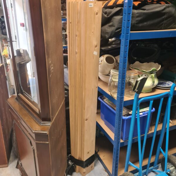 Bundle of pine planks for DIY projects and construction.