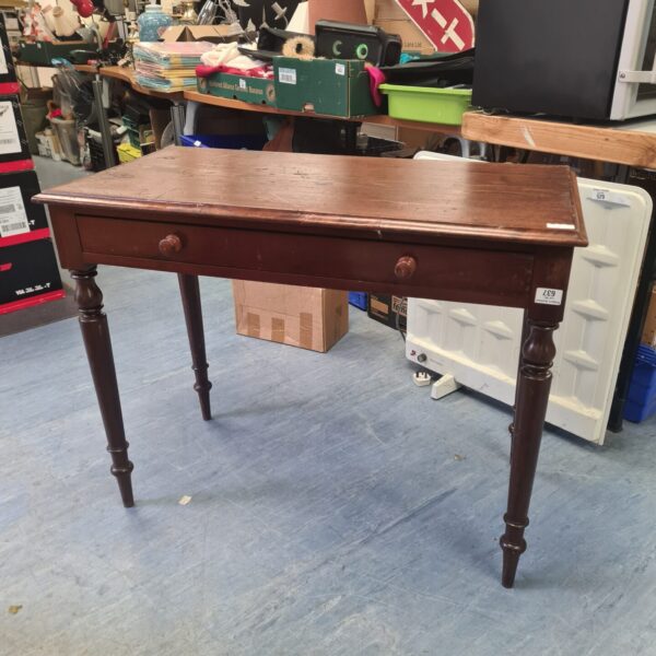 Edwardian mahogany side table with drawer and turned legs.
