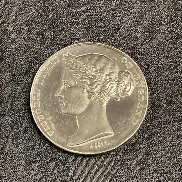 Silver 1862 London Exhibition medal showing Queen Victoria’s portrait.