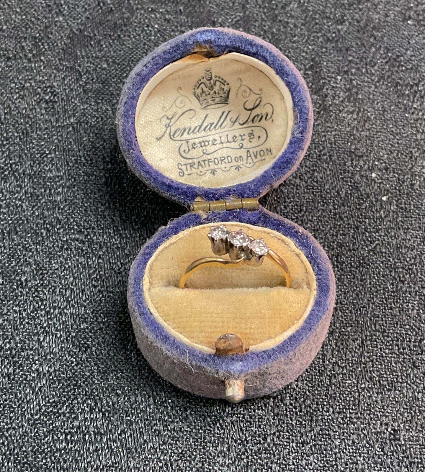 Side view of vintage 18ct gold trilogy diamond ring.