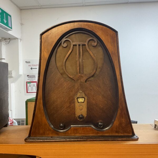 Dark finished 1920s valve radio cabinet, antique radio collector item.