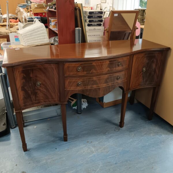 Vintage 1930s serpentine bar cabinet in oak.