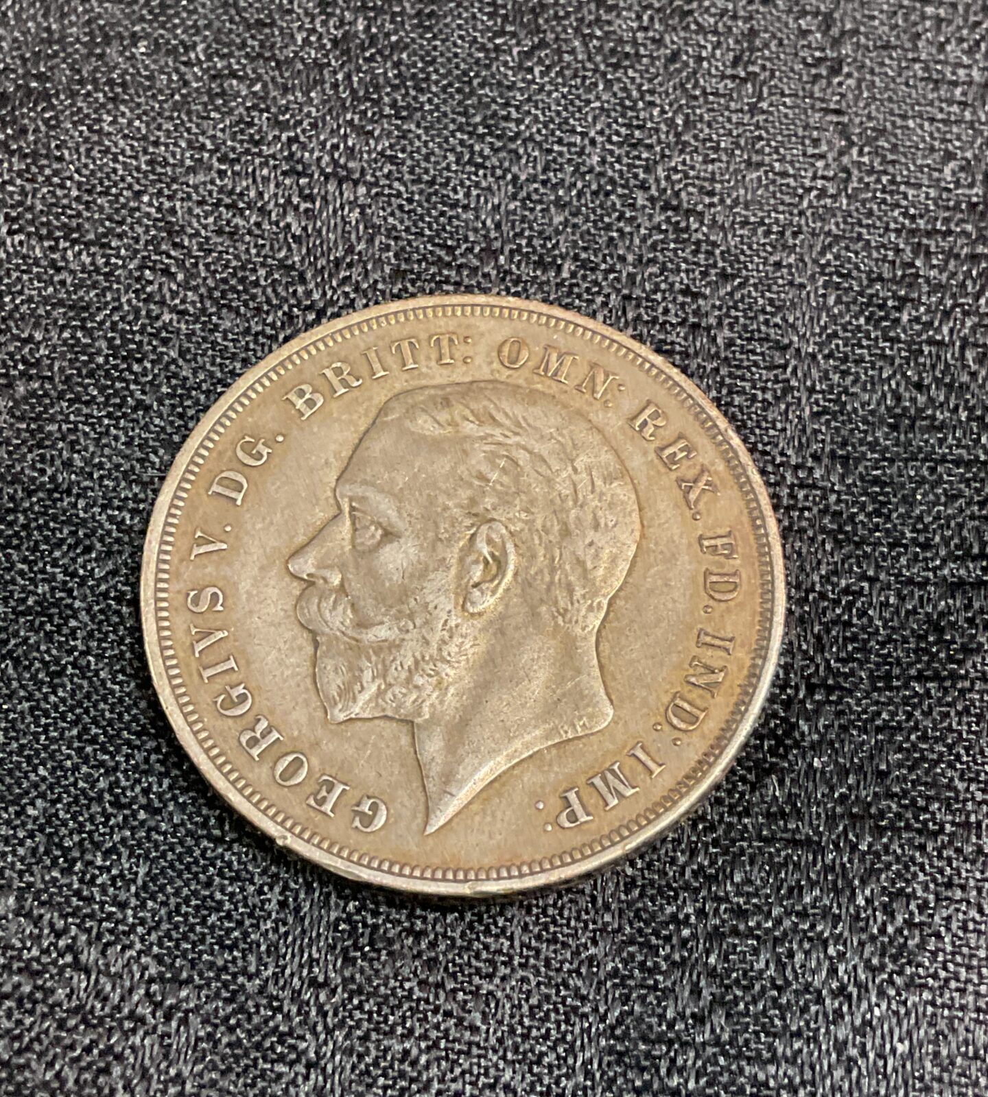 1935 Silver Crown coin featuring King George V portrait.