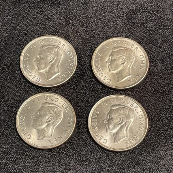Four uncirculated British half crowns from 1944-1946 featuring King George VI.