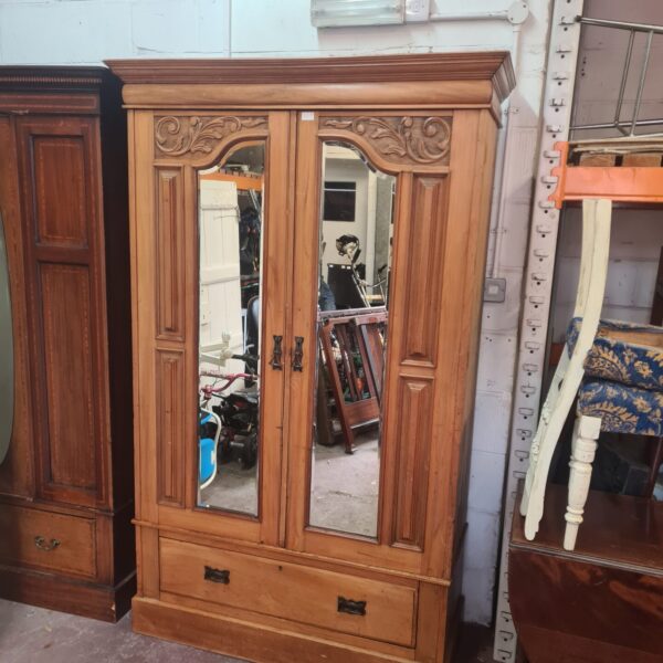 Large antique Art Nouveau oak wardrobe with mirrored doors.