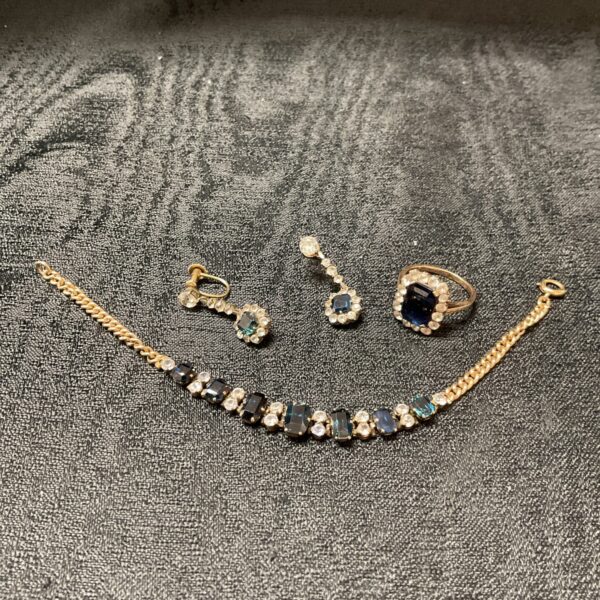 Close-up of 9 carat sapphire and diamond jewellery set.