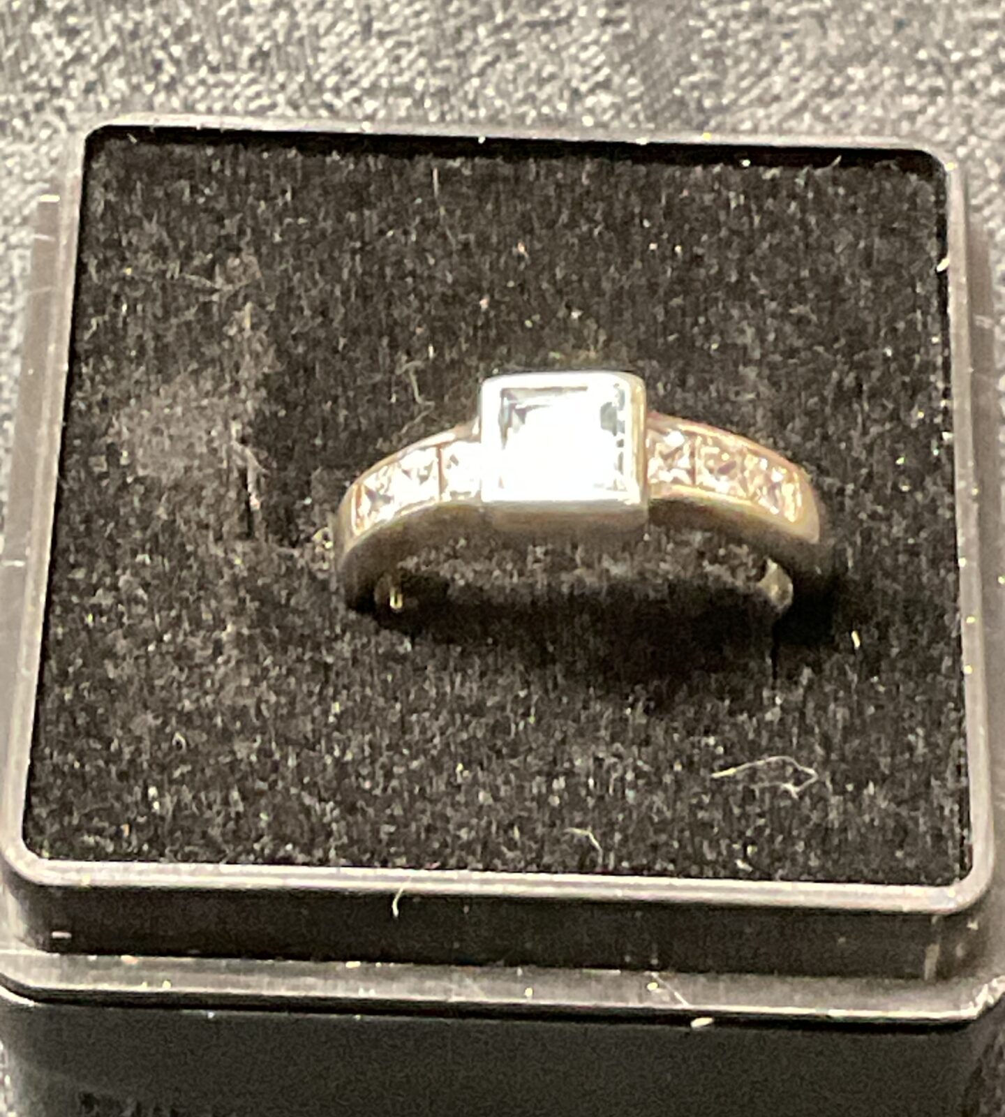 Close-up of a 925 silver ring with blue and white stones.
