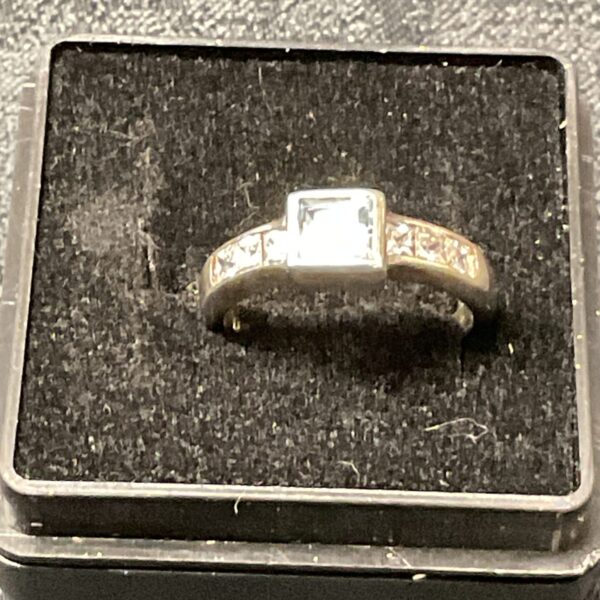 Close-up of a 925 silver ring with blue and white stones.