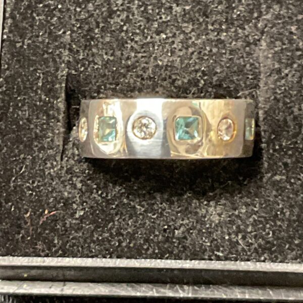 Elegant 925 silver ring with blue and white stones.