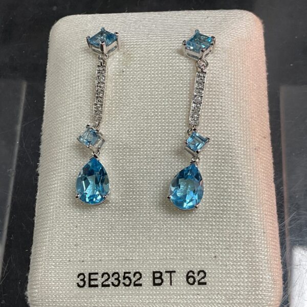 Elegant 9ct gold drop earrings with blue stones.