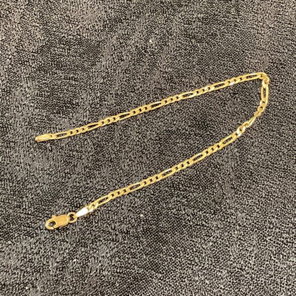 Delicate 9ct gold figaro bracelet with flat links.