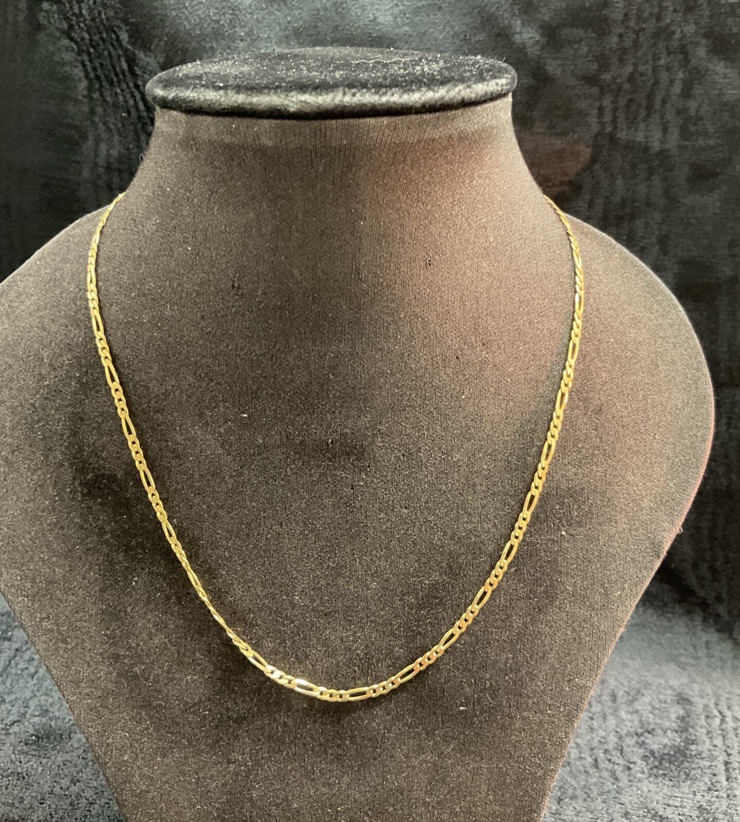 9ct gold Figaro chain necklace, classic jewellery design.