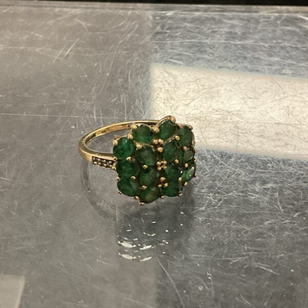 Vintage 9ct gold cocktail ring with green stones.