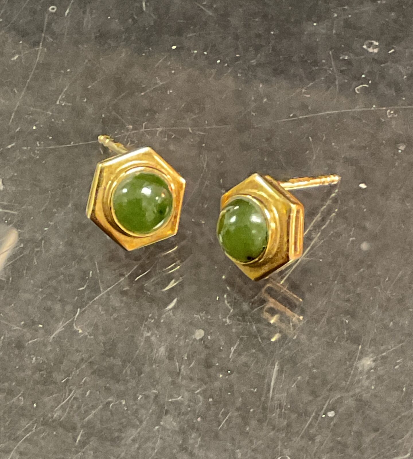 Vintage 9ct gold stud earrings with green stones.