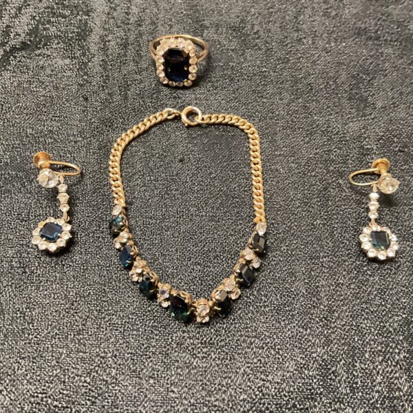9ct gold jewellery set featuring a bracelet, ring, and earrings.