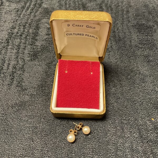 9ct gold pearl stud earrings displayed in a vintage box.