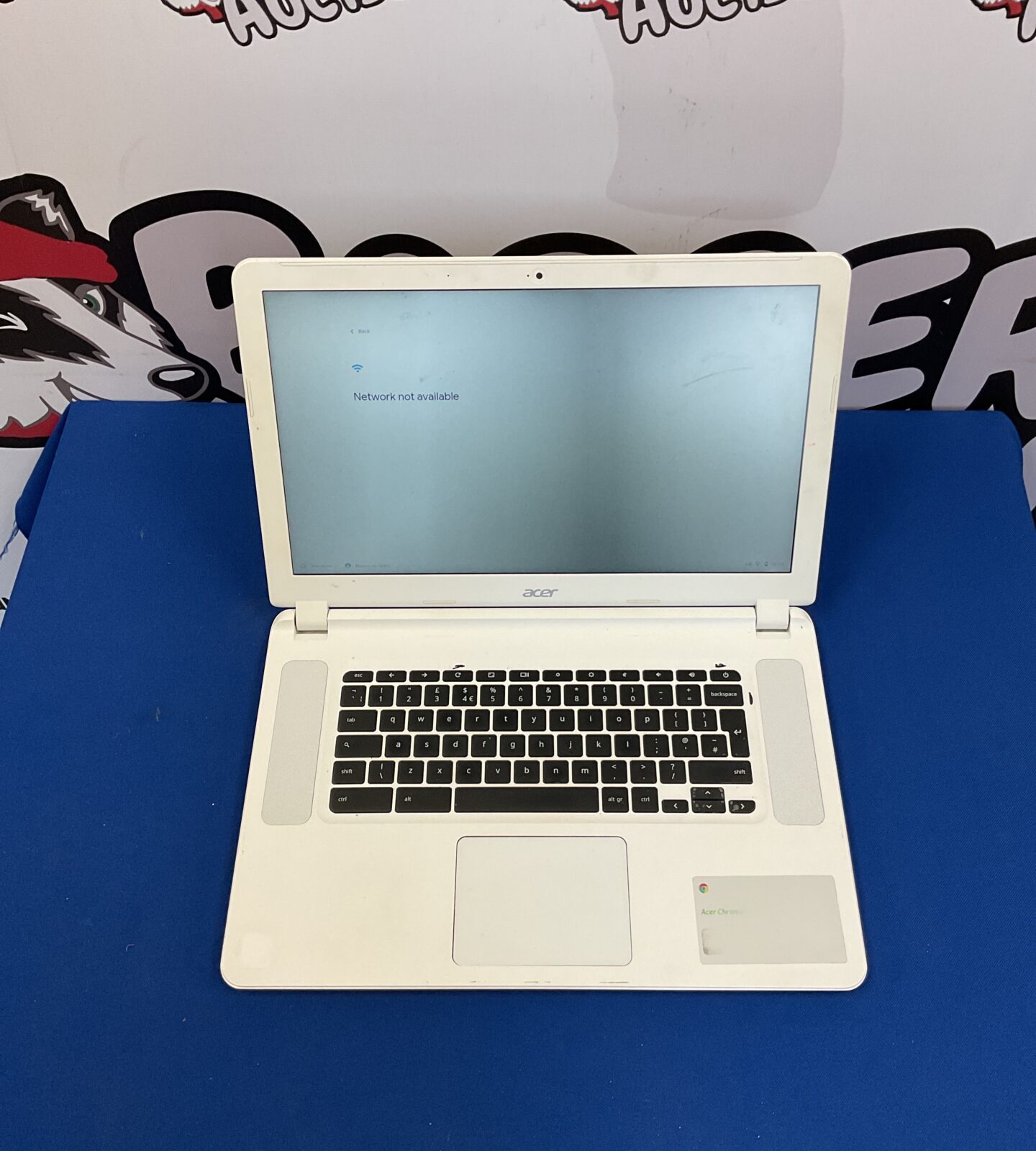 Silver Acer Chromebook CB5-571 laptop open on a desk.