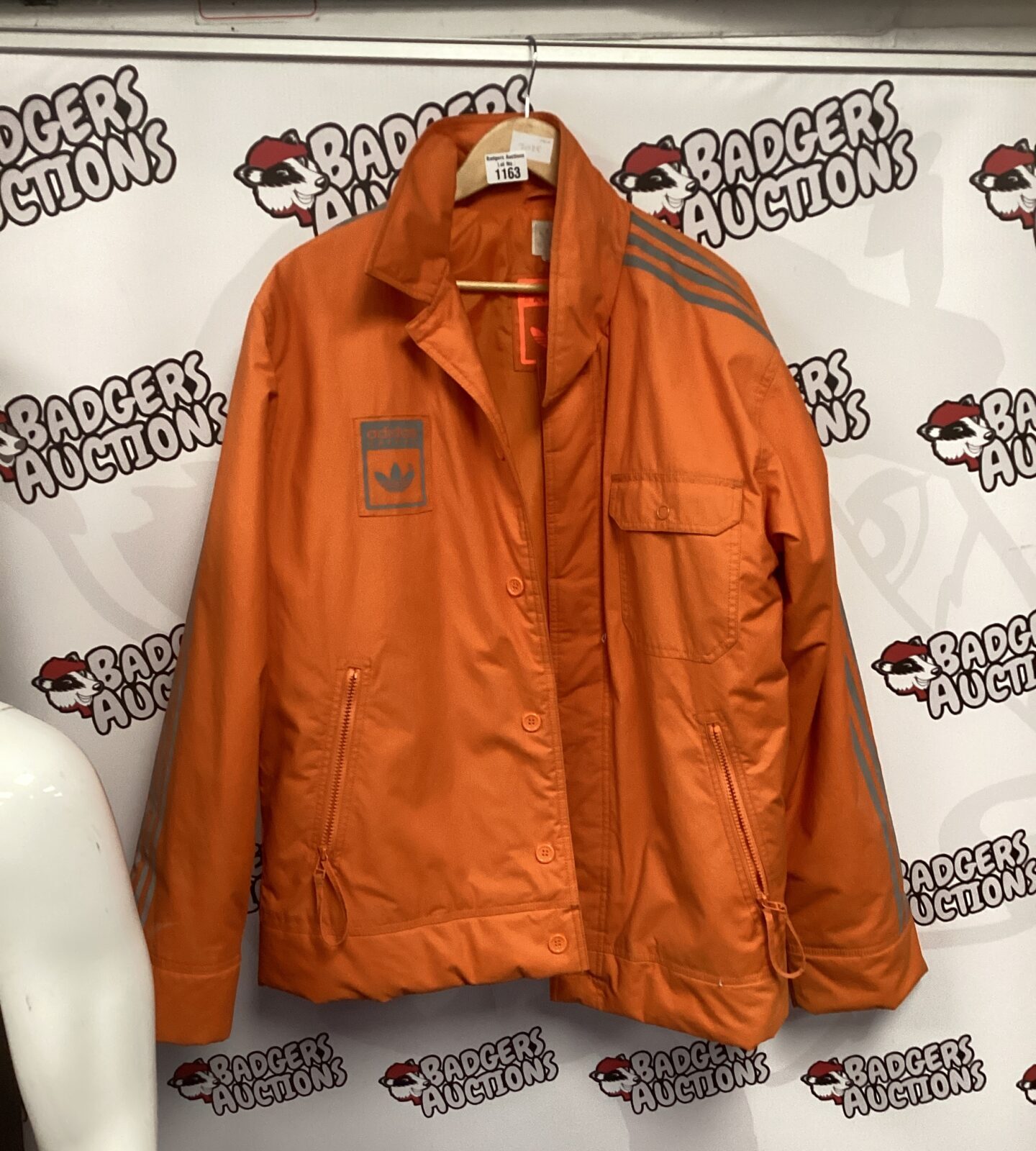 Orange Adidas safety jacket size M with reflective stripes.
