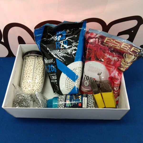 Close-up of airsoft BBs in rzr and psbp packaging.