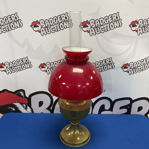 Vintage Aladdin 23 paraffin lamp with red glass shade.