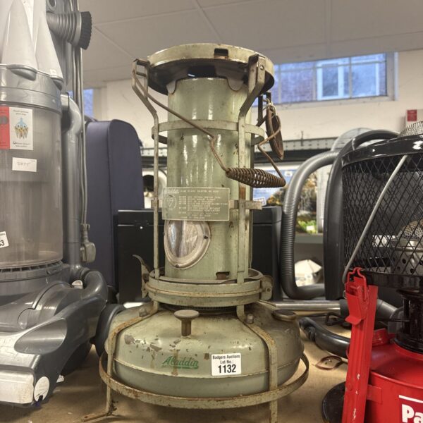 Vintage Aladdin blue flame heater for greenhouses and workshops.