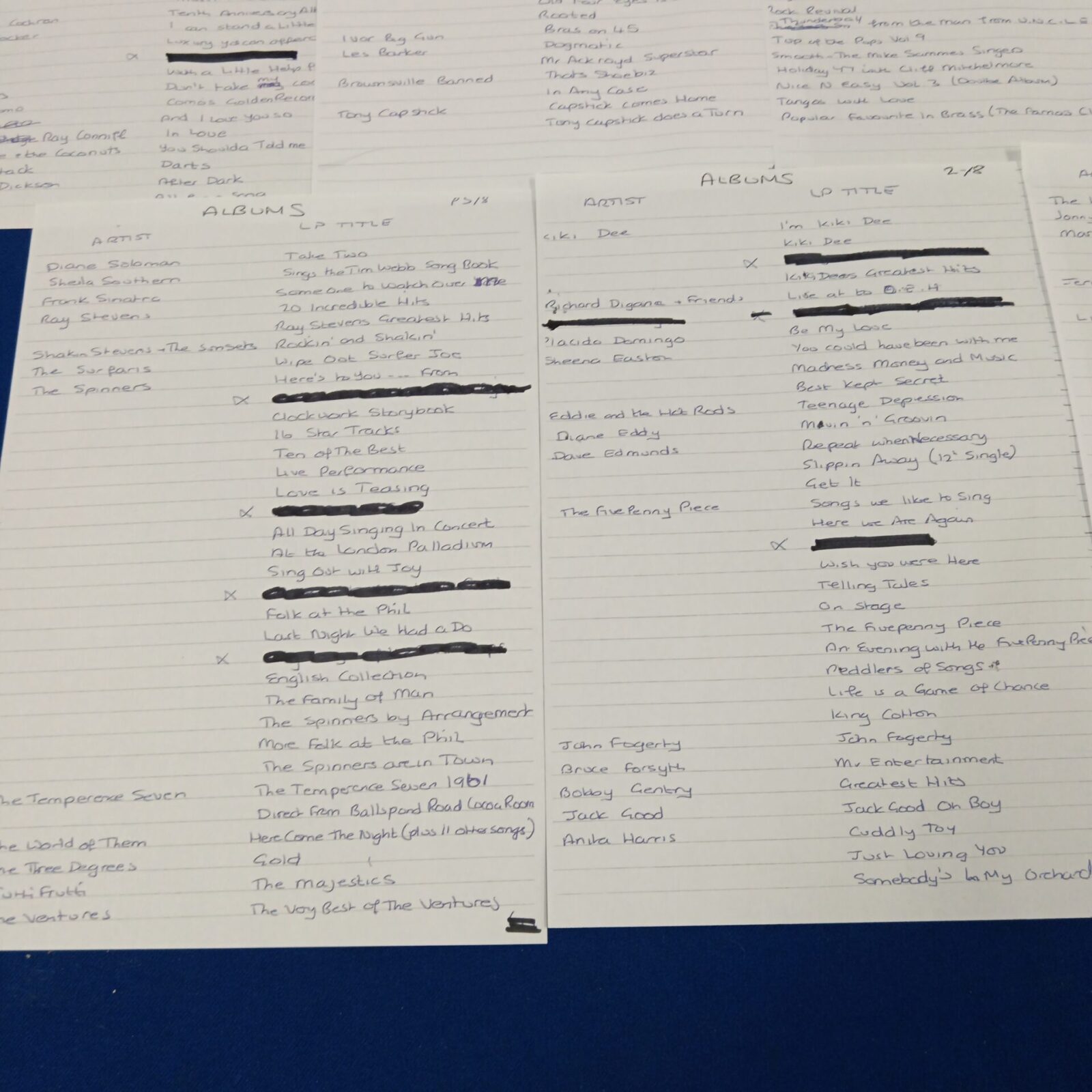 Handwritten list of album titles and artists, page three.